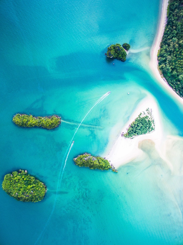 tropical shores from above glass splashback
